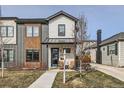 Charming two-story home with a stone porch and inviting curb appeal with minimalist landscaping at 3261 S Sherman St, Englewood, CO 80113