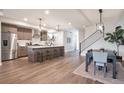 Open-concept kitchen with a large island, modern appliances, and ample counter space, perfect for cooking at 3261 S Sherman St, Englewood, CO 80113