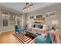 Bright living room with modern decor, stylish furnishings, and natural light at 4961 Aspen Creek Dr, Broomfield, CO 80023