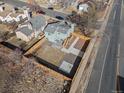 Aerial view of a fenced backyard featuring a concrete patio and low maintenance landscaping at 17990 E Cornell Dr, Aurora, CO 80013