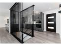 Stylish home interior featuring gray cabinets, stainless appliances and gray wood flooring at 5886 S Logan St, Centennial, CO 80121