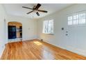 Inviting living room featuring hardwood floors, a ceiling fan, and an abundance of natural light at 4078 Ames St, Wheat Ridge, CO 80212