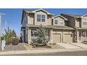 Charming two-story townhome featuring a private porch and a one car garage in a well-maintained community at 202 Ash St, Bennett, CO 80102