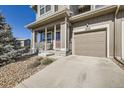 Inviting covered porch and one car garage; a charming townhome in a desirable neighborhood at 202 Ash St, Bennett, CO 80102
