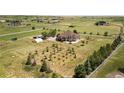Aerial view of the property showcasing the home, land, and surrounding landscape at 34771 E 153Rd Ct, Hudson, CO 80642