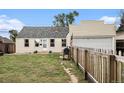 Charming single-story home with a grill and well-manicured lawn at 150 N 7Th Ave, Brighton, CO 80601