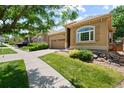 Beautiful single-story house featuring a well maintained lawn and an arched window at 11645 Colony Loop, Parker, CO 80138