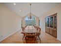 Dining room featuring a large window, a hanging chandelier, and mountain views at 787 W Meadow Rd, Evergreen, CO 80439