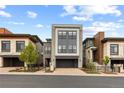 Stylish three-story home featuring an attached two-car garage and neutral exterior color palette at 10113 Bellwether Ln, Lone Tree, CO 80124