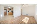 Bright living room featuring hardwood floors, ceiling fan, and natural light at 1151 Xanthia St, Denver, CO 80220