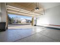 Spacious two-car garage with epoxy flooring and open view at 20697 E Lake Ave, Centennial, CO 80016