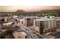 Stunning aerial view captures the urban setting with modern apartments and distant mountain scenery at 20 Wilcox St # 318, Castle Rock, CO 80104