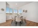 Cozy dining area with scenic views from three large windows, perfect for Gathering meals at 3389 Cranston Cir # 3389, Highlands Ranch, CO 80126