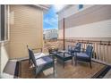 Inviting outdoor seating area with a fire pit, perfect for relaxing and entertaining at 3389 Cranston Cir, Highlands Ranch, CO 80126