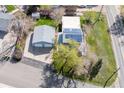 Overhead view of a home with a two-car garage, solar panels, and well-maintained lawn at 3995 Easley Rd, Golden, CO 80403