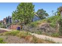 View of the home's backyard, showing yard and trees at 3547 Osage St, Denver, CO 80211