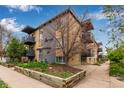 Apartment building features brick exterior, balconies and mature landscaping at 200 N Sherman St # 7, Denver, CO 80203