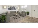 Bright living room featuring neutral tones, stylish decor, and comfortable seating arrangements at 9283 Sedalia St, Commerce City, CO 80022