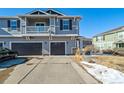 Two-story townhome with double garage and balcony at 17358 Waterhouse Cir # F, Parker, CO 80134