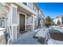 Townhome entrance with dark brown door and stone accents at 17358 Waterhouse Cir # F, Parker, CO 80134