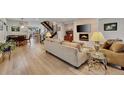 Living room featuring a modern fireplace, stylish decor, and an open floor plan at 613 Iowa St, Golden, CO 80403