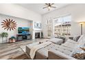 Inviting living room with natural light, a fireplace, and comfortable seating at 5231 S Greens Cir, Littleton, CO 80123