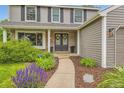 Inviting front door with wreaths and beautiful landscaping leading up to the entrance at 7708 S Krameria Ct, Centennial, CO 80112