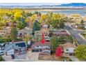 Aerial view of the house showing the neighborhood, with mountain views and proximity to Sloan's Lake at 9055 Holland St, Broomfield, CO 80021