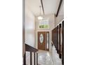 Bright entryway featuring tile flooring, a decorative glass door, and modern lighting at 848 S 13Th Ave, Brighton, CO 80601