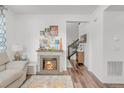 Living room with fireplace and view of staircase at 14063 Jackson St, Thornton, CO 80602