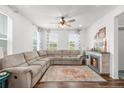 Spacious living room with corner sectional and fireplace at 14063 Jackson St, Thornton, CO 80602