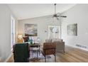 Bright and airy living room with vaulted ceilings, stylish furnishings, and wood-look flooring at 19644 E Girard Dr, Aurora, CO 80013