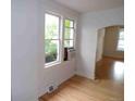 Bright living room featuring hardwood floors, white walls, and natural light at 1346 S Logan St, Denver, CO 80210