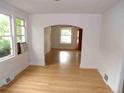 Bright and airy living room featuring gleaming hardwood floors and lots of windows at 1346 S Logan St, Denver, CO 80210