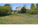Spacious backyard featuring a fenced yard perfect for outdoor activities and privacy at 2938 Wolfensberger Rd, Sedalia, CO 80135