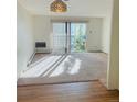 Living room with sliding glass doors to outside deck, with plush carpeting at 695 S Alton Way # 6B, Denver, CO 80247
