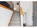 Welcoming staircase with carpeted steps and wooden handrails, leading to the upper level at 9379 W Burgundy Ave, Littleton, CO 80123
