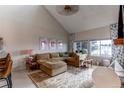 Spacious living room featuring a comfortable sectional sofa and large windows at 8855 Green Meadows Dr, Highlands Ranch, CO 80126