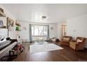 Spacious living room with hardwood floors, a large window, and comfortable seating at 1331 Alpine St, Longmont, CO 80504