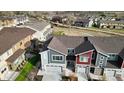 Aerial view of modern townhomes showcasing well-maintained landscaping and community layout at 9756 Ash Ln, Thornton, CO 80229