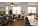 Inviting living area with a cozy couch, natural light, and elegant furnishings at 9756 Ash Ln, Thornton, CO 80229