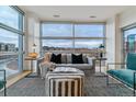 Bright living room with floor to ceiling windows at 2958 Syracuse St # 303, Denver, CO 80238