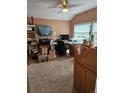 Functional home office with natural light, desk, and ample storage at 4484 Juniper Ct, Larkspur, CO 80118
