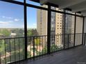 Enjoy city views from this balcony, with its black metal railing and bright daylight at 7865 E Mississippi Ave # 706, Denver, CO 80247
