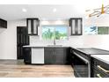 Bright kitchen featuring modern cabinets, stainless steel appliances, and hardwood floors at 220 S Raleigh St, Denver, CO 80219