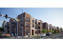 Contemporary multi-story condos with mixed brick and modern facade near the Sheridan intersection at 1634 N Sheridan Blvd # 101, Denver, CO 80204