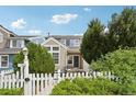 Inviting home exterior with a picket fence and a well-manicured lawn at 2408 Concord Cir, Lafayette, CO 80026