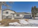 Ranch style home with gray exterior, attached garage, and small yard at 3369 E 118Th Way, Thornton, CO 80233