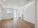 Bright living room with hardwood floors and large windows at 1374 Penner Dr, Erie, CO 80026