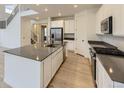 Modern kitchen with stainless steel appliances and a sleek island at 39857 Floyd St, Elizabeth, CO 80107